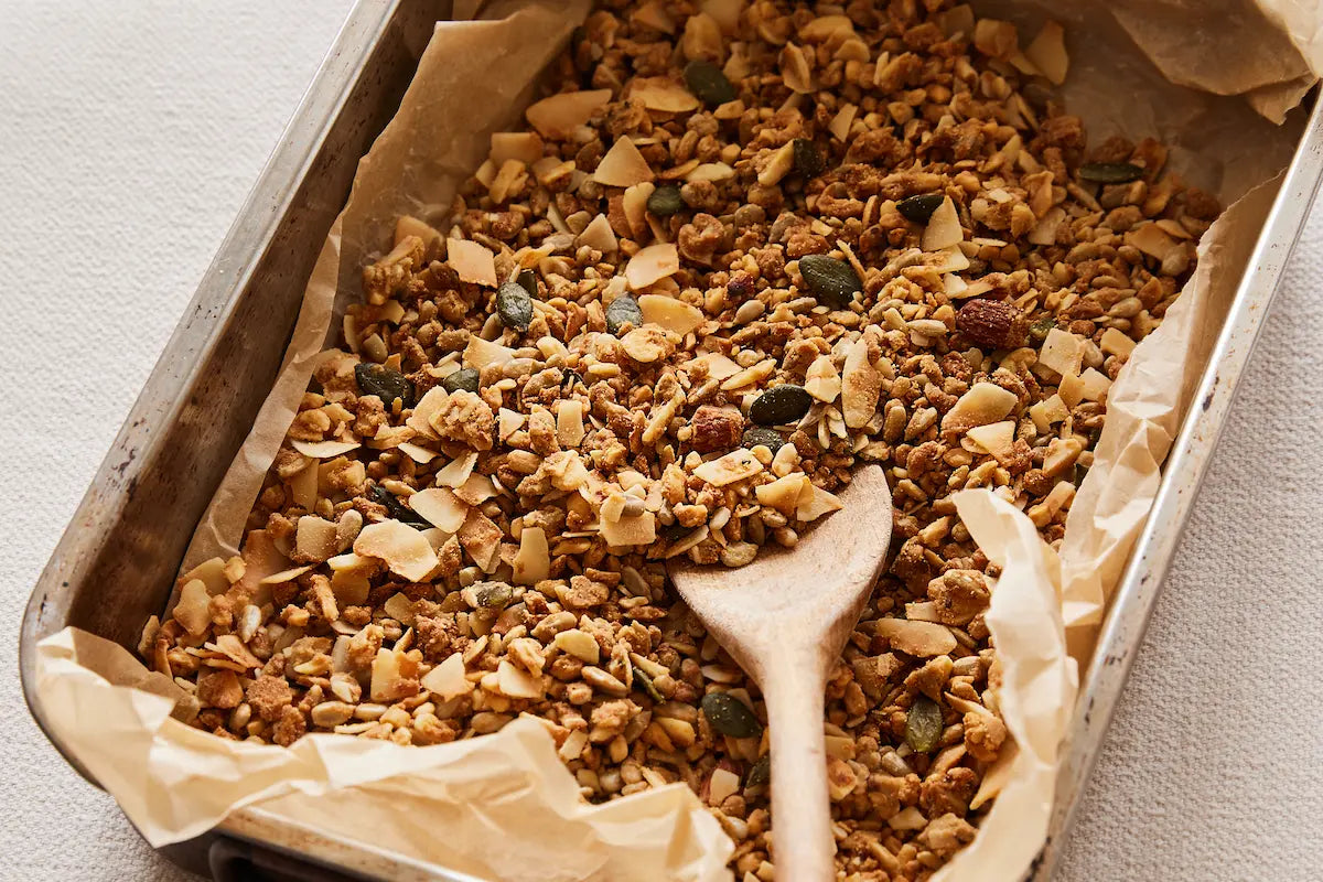 Paleo Foods Co. Protein Boost peanut butter granola in a baking tray, freshly small batch baked